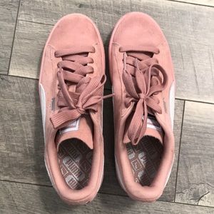 Pink and white suede pumas
